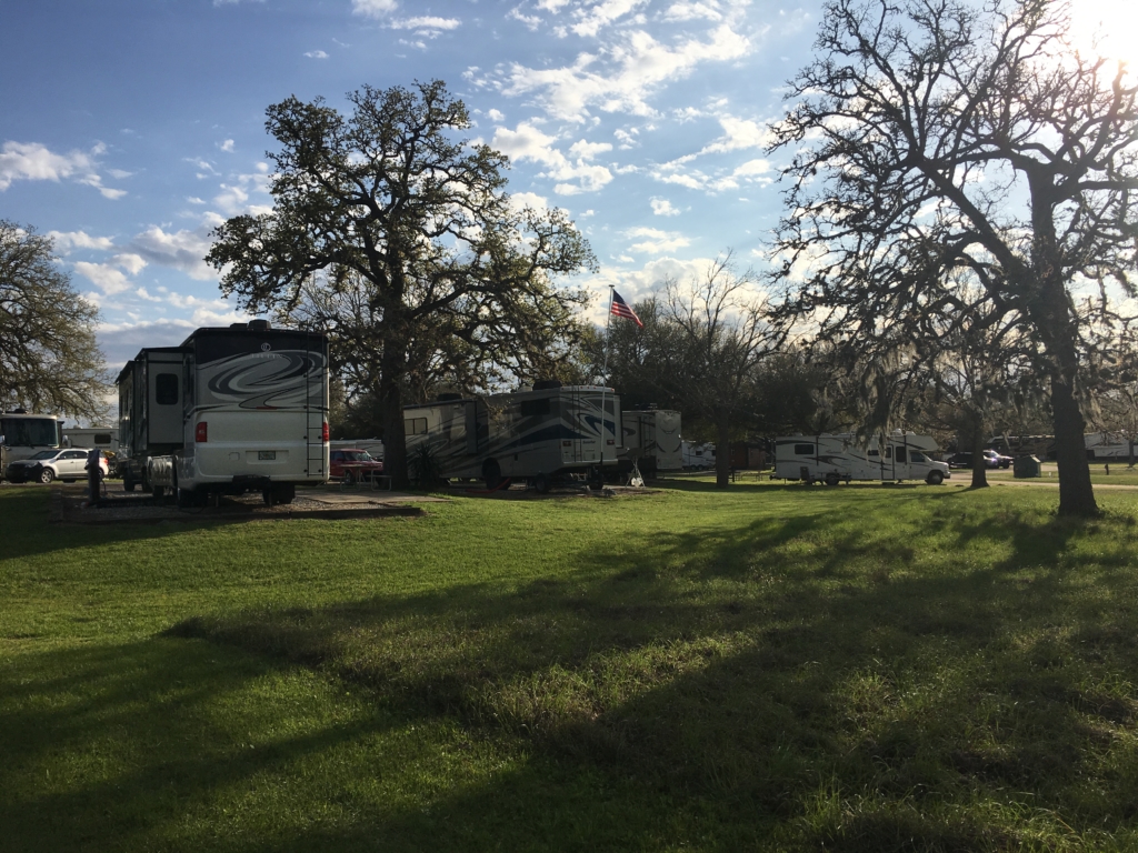 View of back of campsites at Thousand Trails in Columbus, Texas