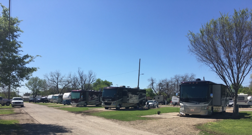 Row of RVs parked at Riverwalk RV Park in San Antonio, Texas